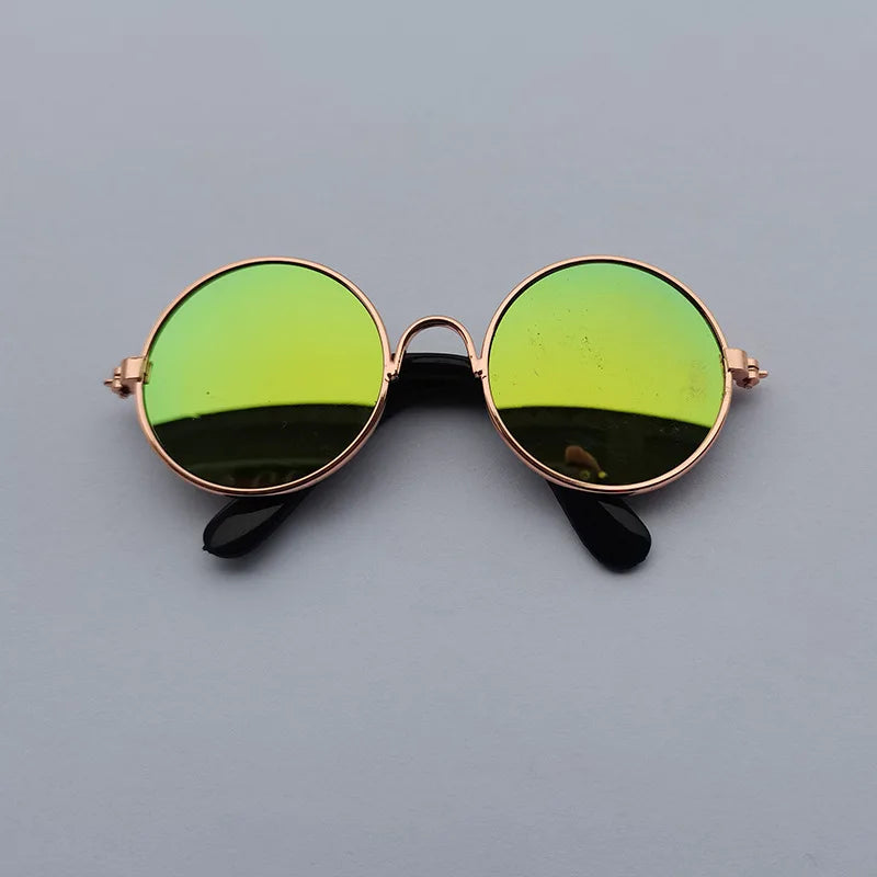 Green dog sunglasses with bronze frame.