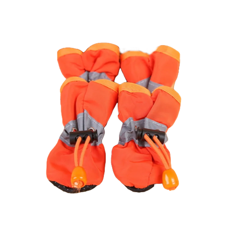 Orange waterproof dog shoes with tightening mechanism.