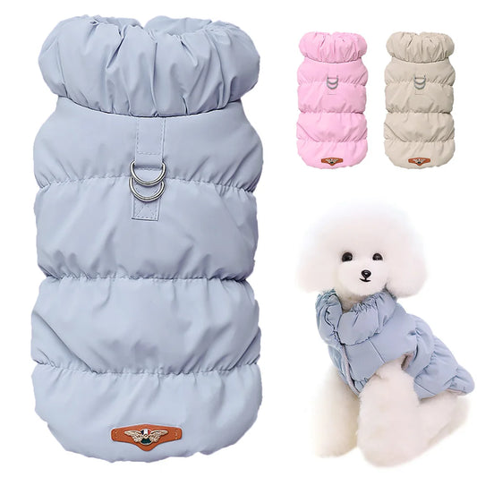 Light blue, pink, and tan puffy dog vests. Bottom-right shows a small white dog in a a blue puffy dog vest.