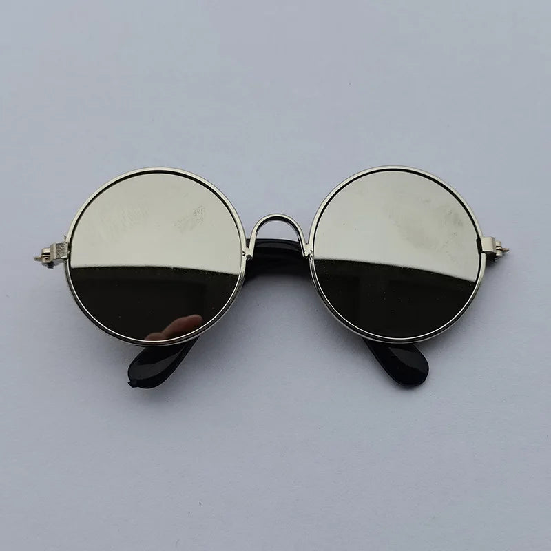 Silver reflective dog sunglasses with silver frame.