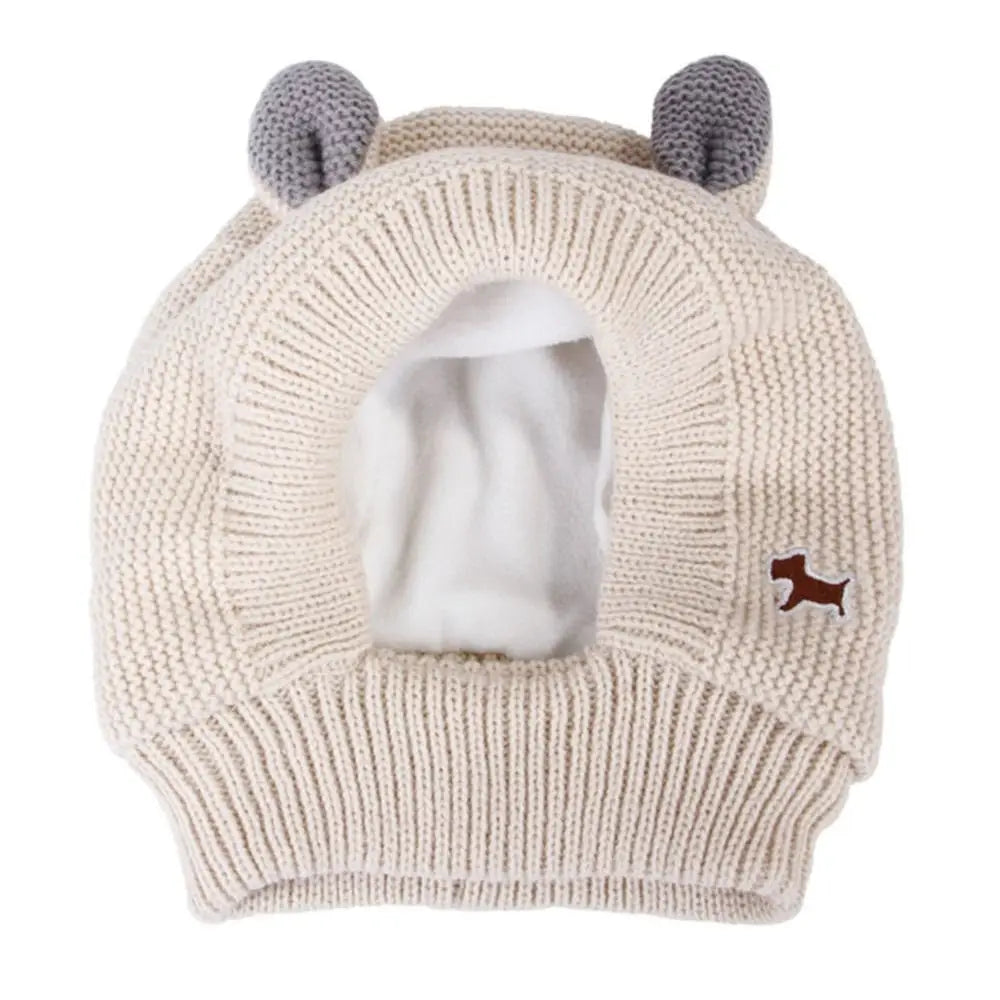 White knitted dog hat with gray ears.